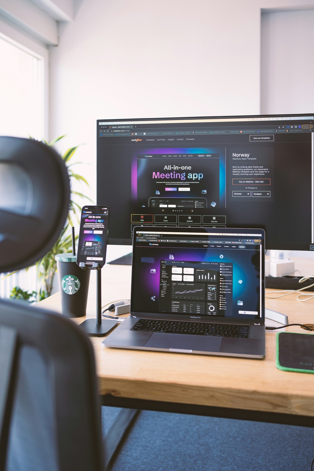 Multi-tenant CMS rendered on desktop and laptop