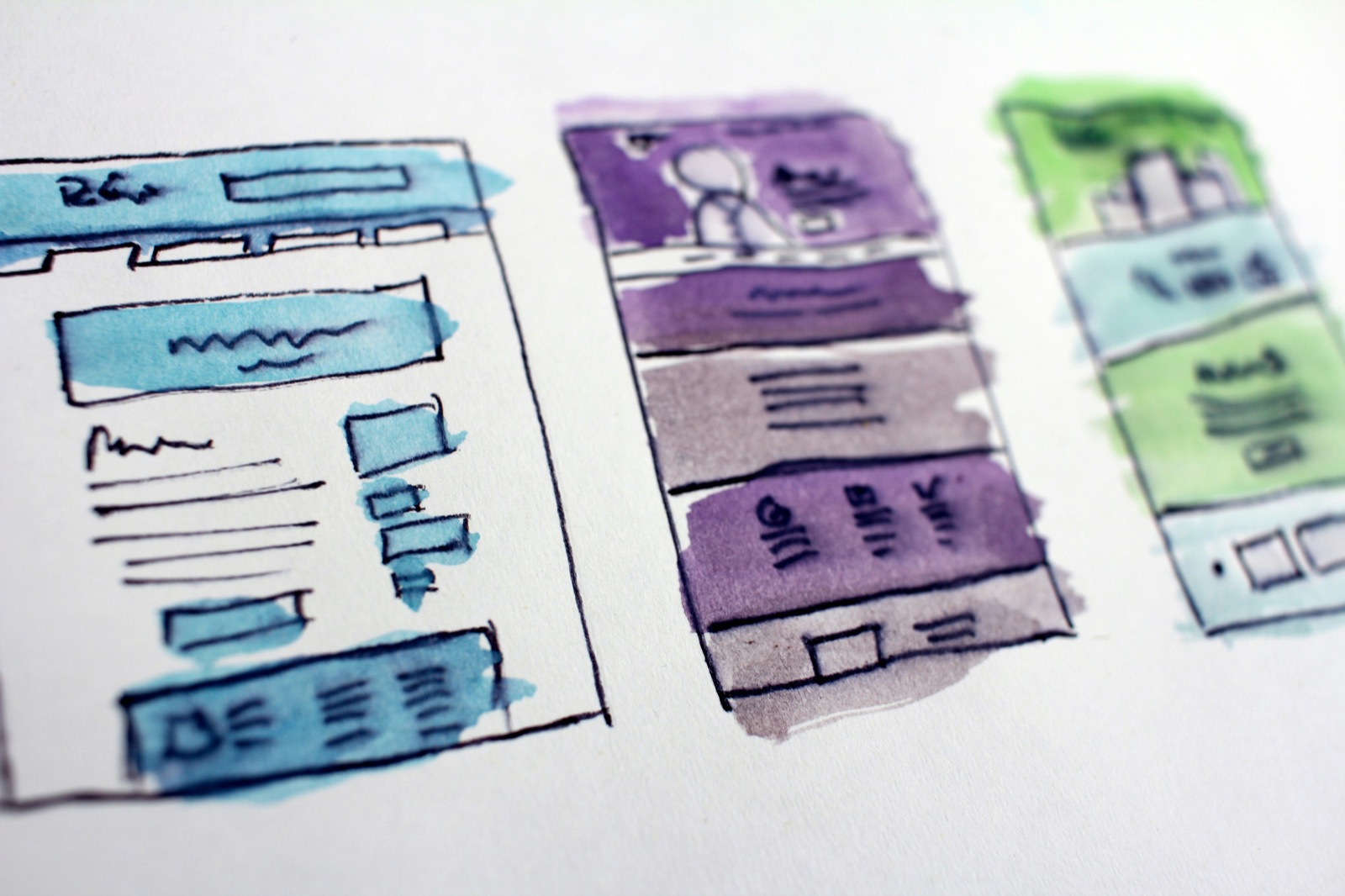 Hand-painted website wireframes in tiered layouts